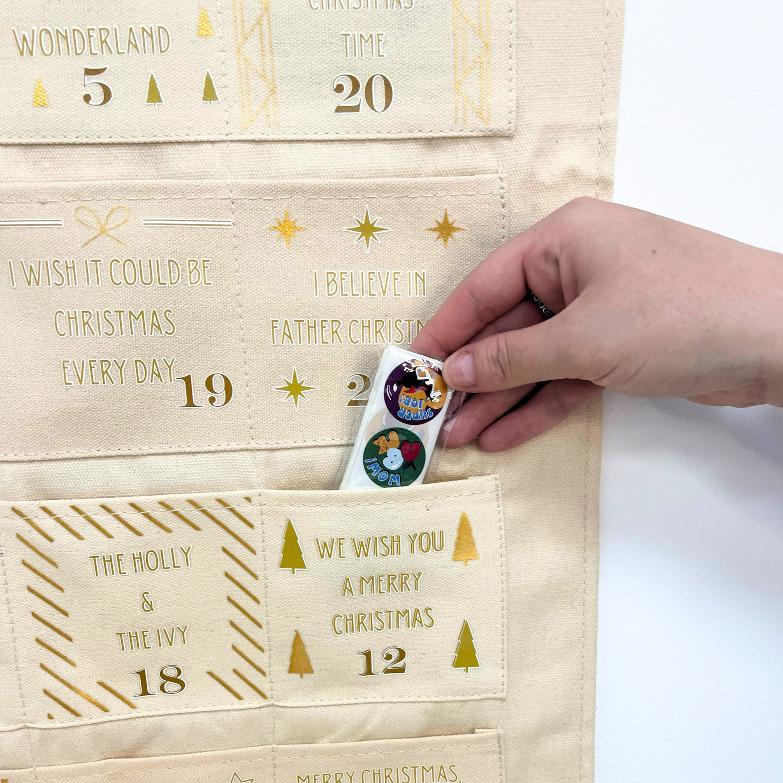 Fabric advent calendar featuring popular Christmas songs and personalised design