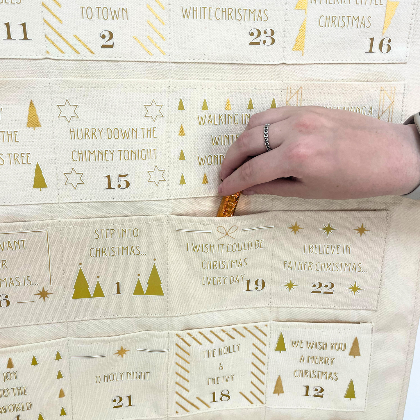 Song advent calendar with pockets for treats, activities, or festive music notes
